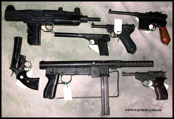 60. Assorted Pistols and Machine Guns